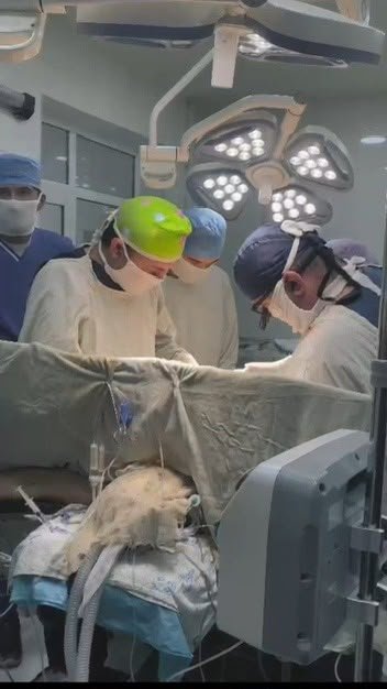 Surgical team at work in a modern operating theatre at an ASMI-affiliated teaching hospital